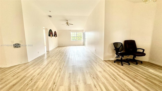 living area with light wood-type flooring, vaulted ceiling, and ceiling fan