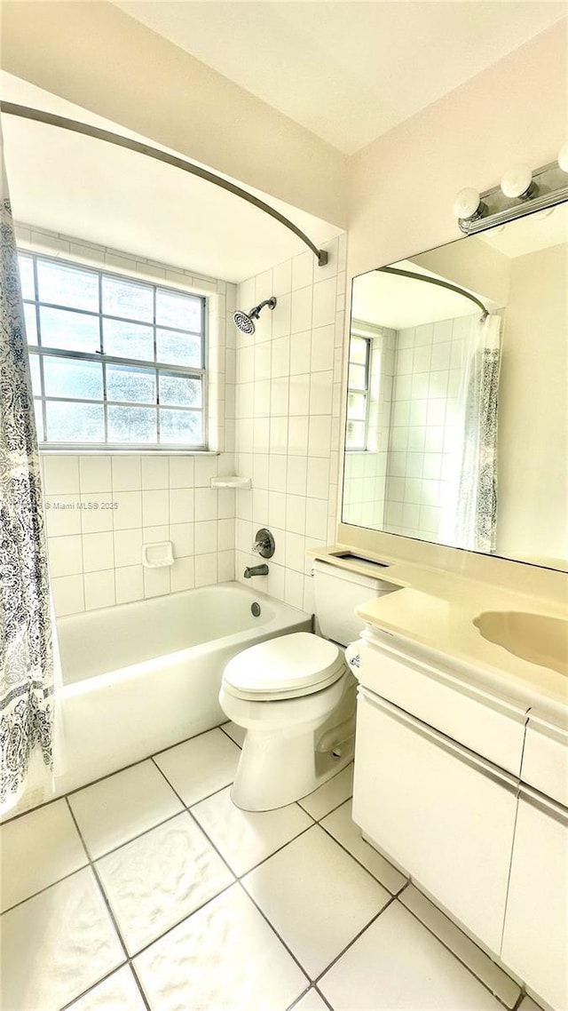 full bathroom featuring shower / bathtub combination with curtain, tile patterned flooring, vanity, and toilet