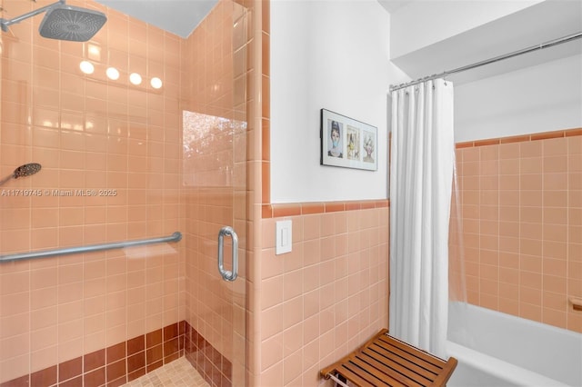 bathroom with curtained shower and tile walls