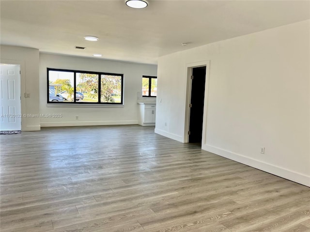 spare room featuring light hardwood / wood-style flooring