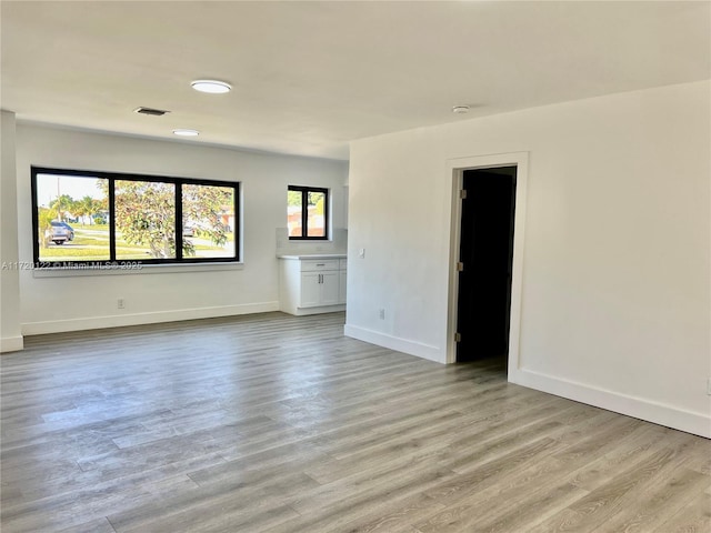 unfurnished room featuring light hardwood / wood-style flooring