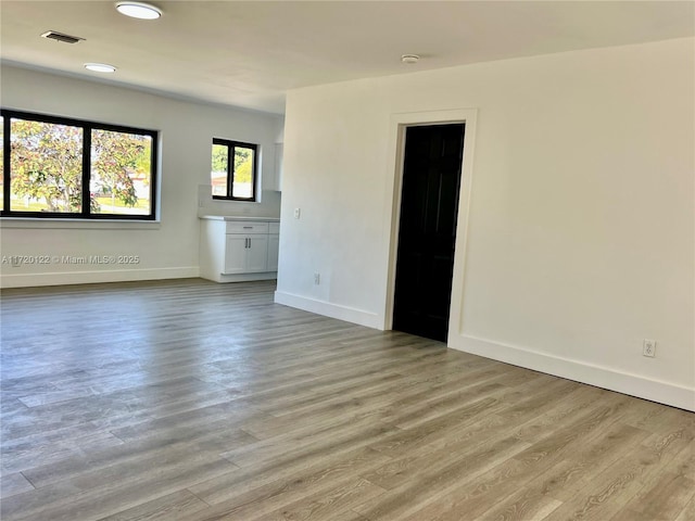 empty room with light wood-type flooring