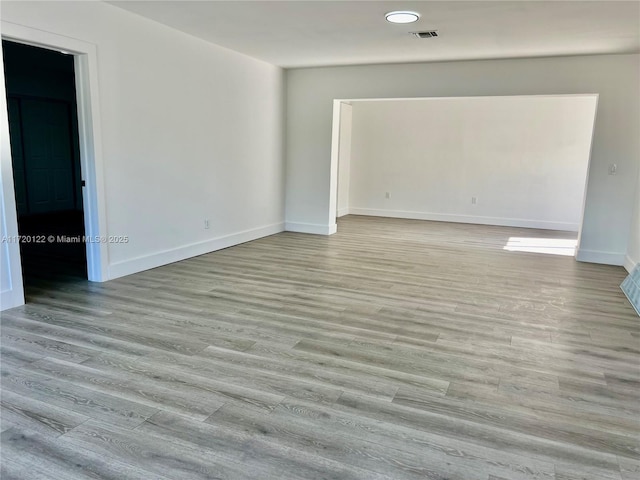 empty room with light wood-type flooring