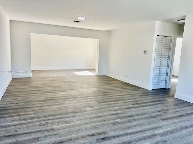 spare room featuring hardwood / wood-style flooring