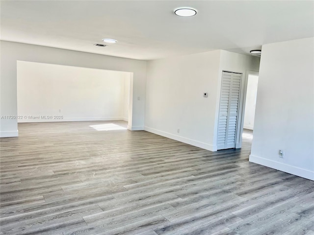 empty room with light wood-type flooring