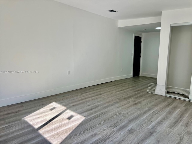 unfurnished room with light hardwood / wood-style floors