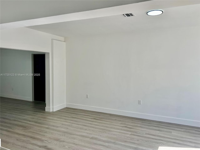 empty room with light hardwood / wood-style floors