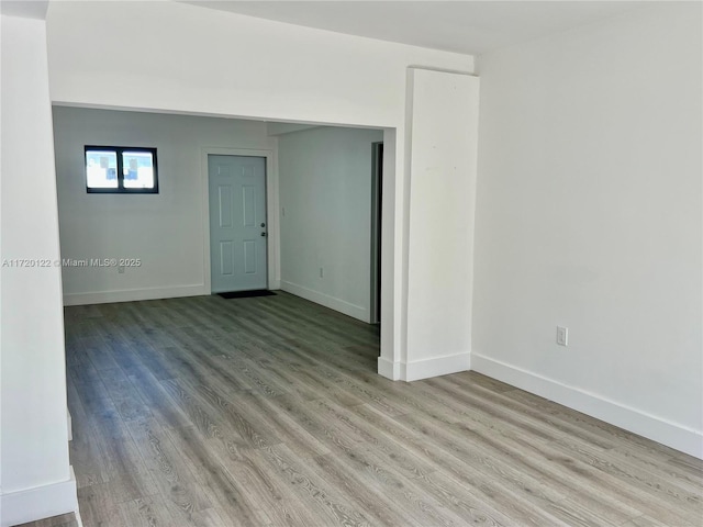 spare room featuring light hardwood / wood-style flooring