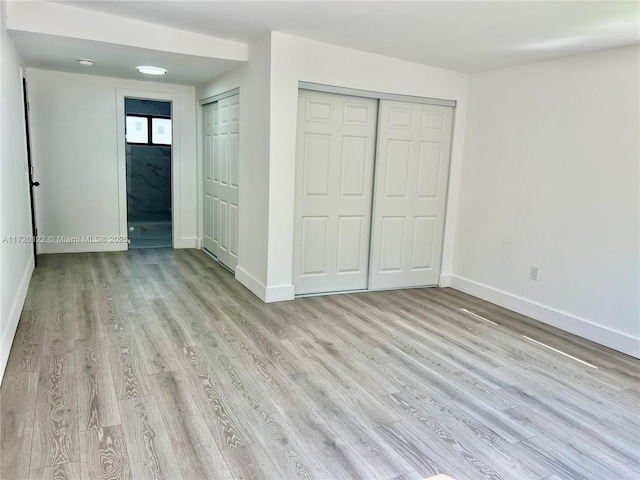 unfurnished bedroom with light hardwood / wood-style flooring