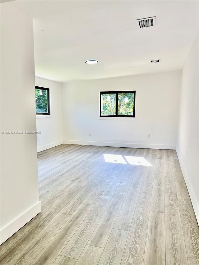 empty room with light wood-type flooring