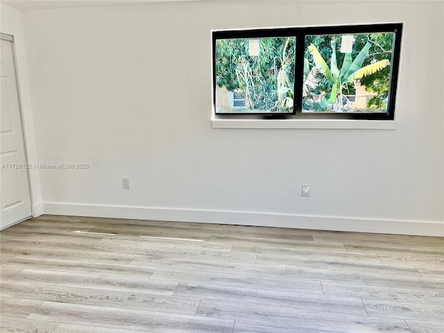 unfurnished room featuring light hardwood / wood-style flooring