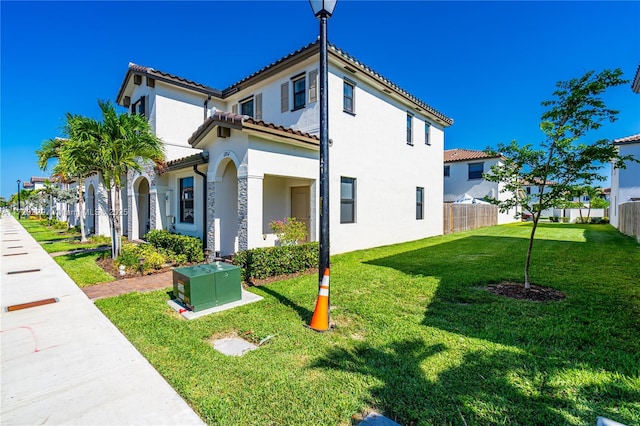 view of side of home featuring a lawn