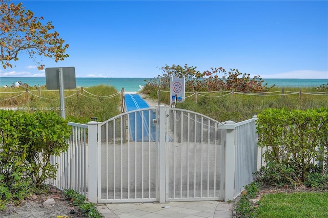 view of gate featuring a water view