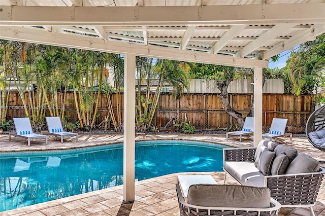 view of swimming pool featuring a patio area