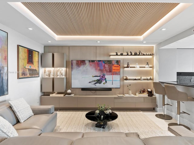 interior space with a tray ceiling and light tile patterned flooring