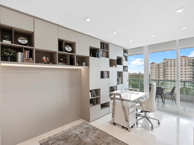 office with built in features and a wall of windows