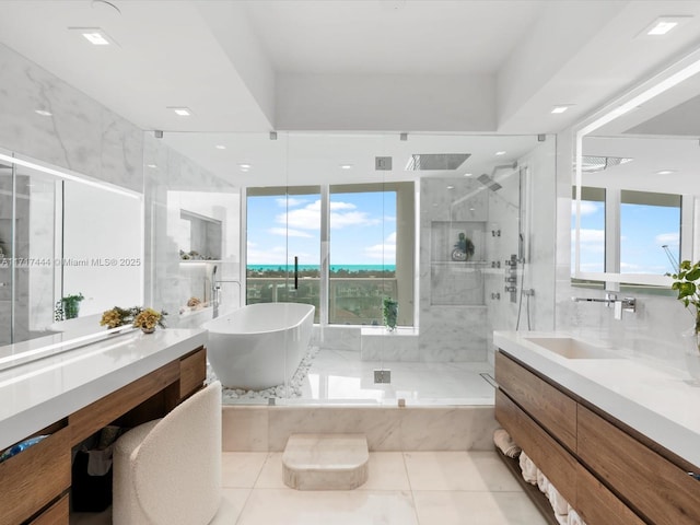 19955 NE 38th Ct Unit 1103, Aventura, FL 33180 - bathroom with a marble finish shower, vanity, a freestanding tub, and recessed lighting