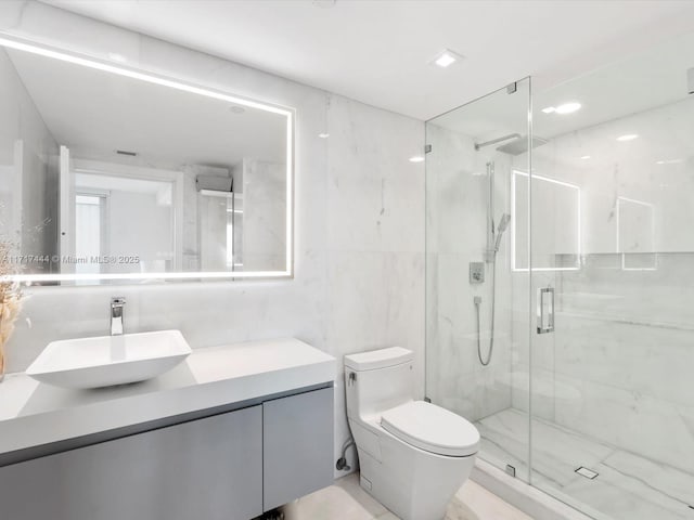 19955 NE 38th Ct Unit 1103, Aventura, FL 33180 - bathroom featuring vanity, a marble finish shower, and recessed lighting