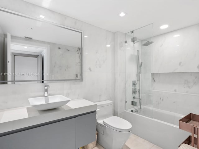 19955 NE 38th Ct Unit 1103, Aventura, FL 33180 - full bathroom featuring vanity, tub / shower combination, tile walls, and tile patterned flooring