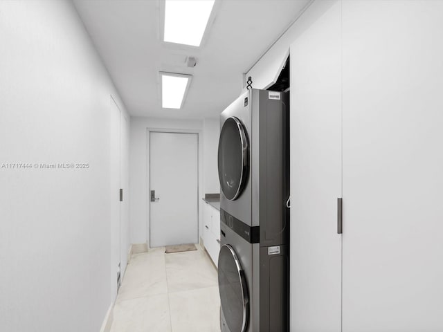 laundry area featuring stacked washer and dryer