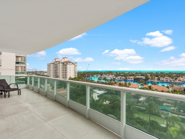 balcony featuring a water view