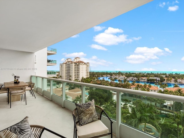 balcony featuring a water view