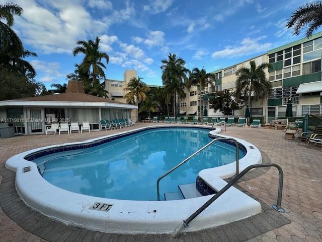 view of swimming pool featuring a patio area