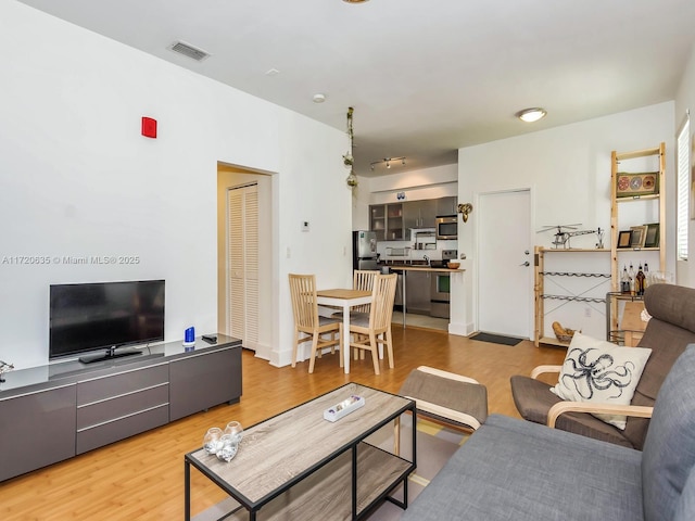 living room with hardwood / wood-style flooring