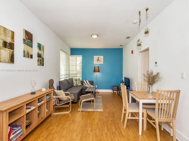 living room with light hardwood / wood-style flooring