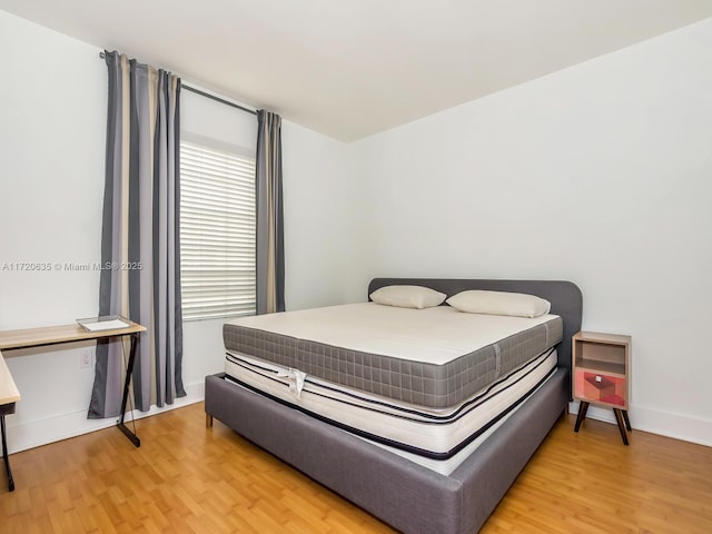 bedroom featuring wood-type flooring