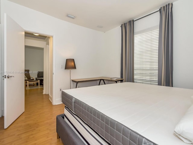 bedroom featuring light wood-type flooring