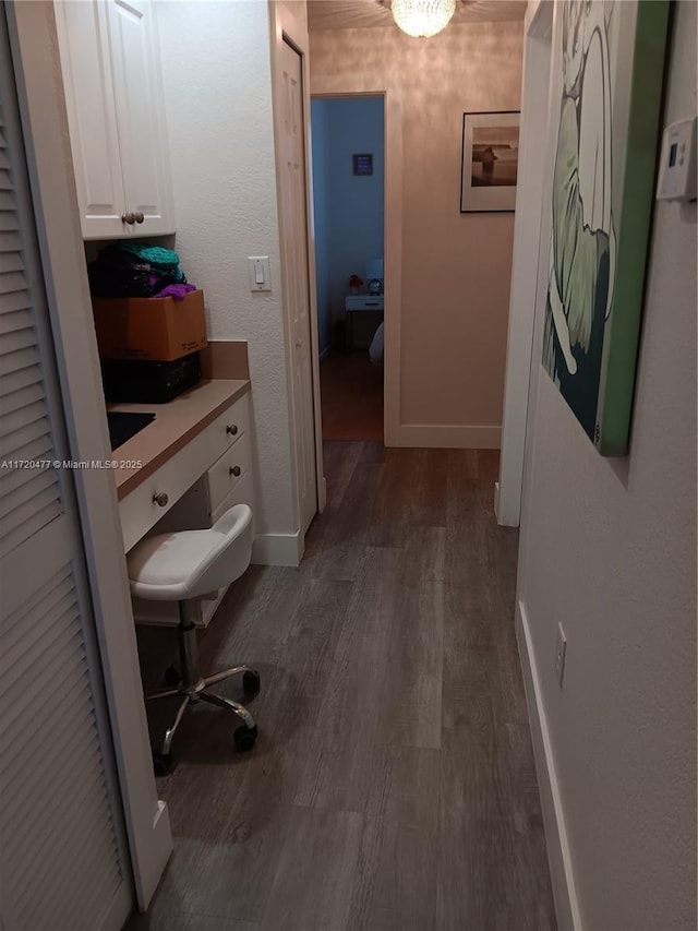 hallway featuring dark hardwood / wood-style flooring