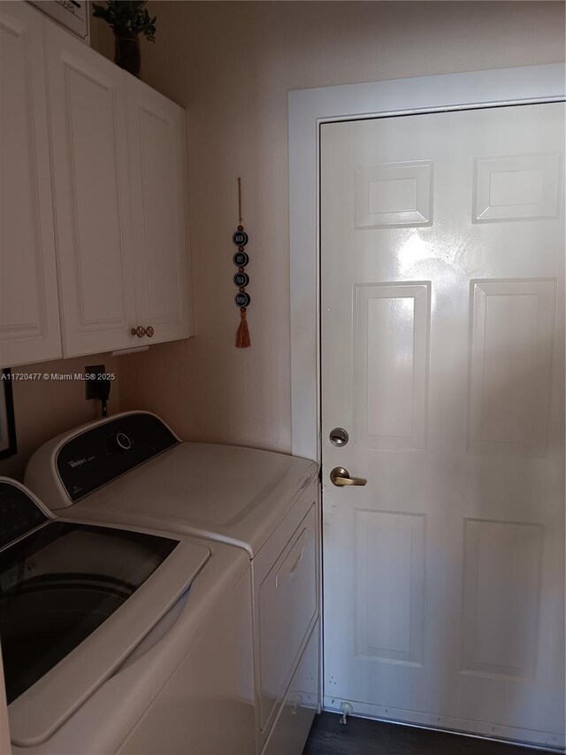 clothes washing area with cabinets and independent washer and dryer