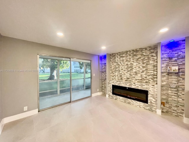 unfurnished living room featuring a fireplace