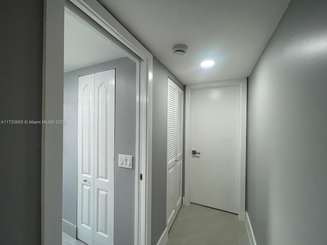 corridor featuring light tile patterned floors