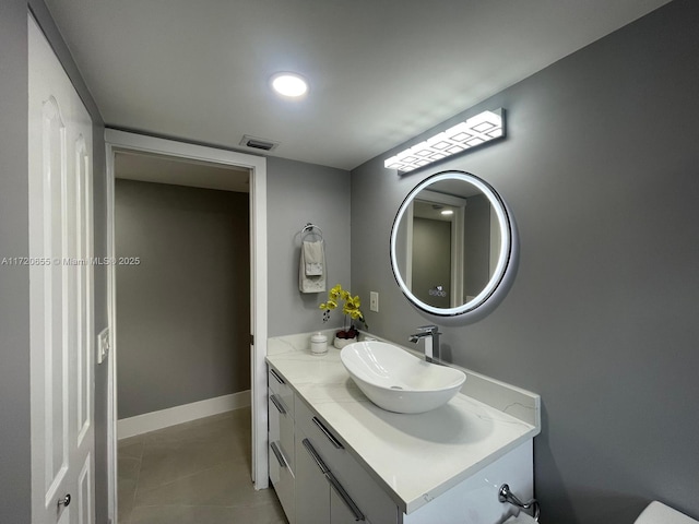 bathroom featuring tile patterned floors and vanity