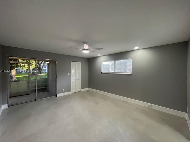 unfurnished room with ceiling fan