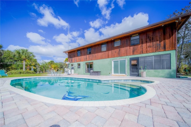 view of swimming pool featuring a patio