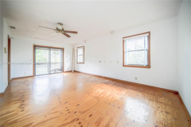 unfurnished room with ceiling fan and light wood-type flooring