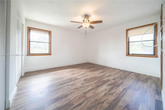 unfurnished bedroom featuring wood-type flooring, a closet, and ceiling fan
