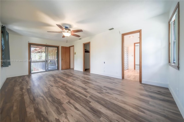 interior space featuring ceiling fan and dark wood-type flooring