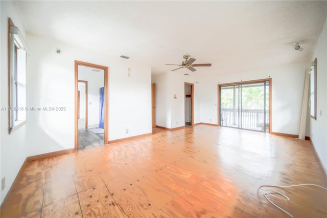 empty room with light hardwood / wood-style floors and ceiling fan