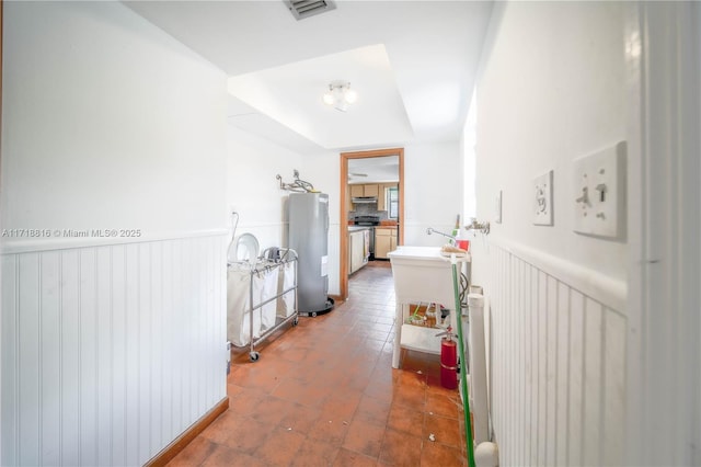 hallway featuring water heater