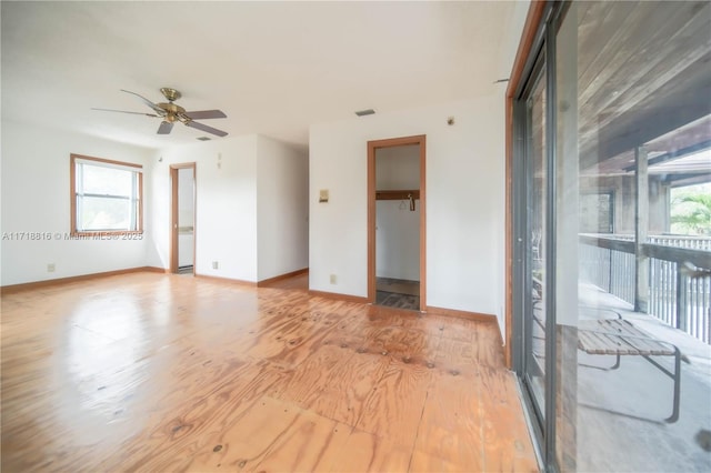 empty room featuring light hardwood / wood-style flooring and ceiling fan
