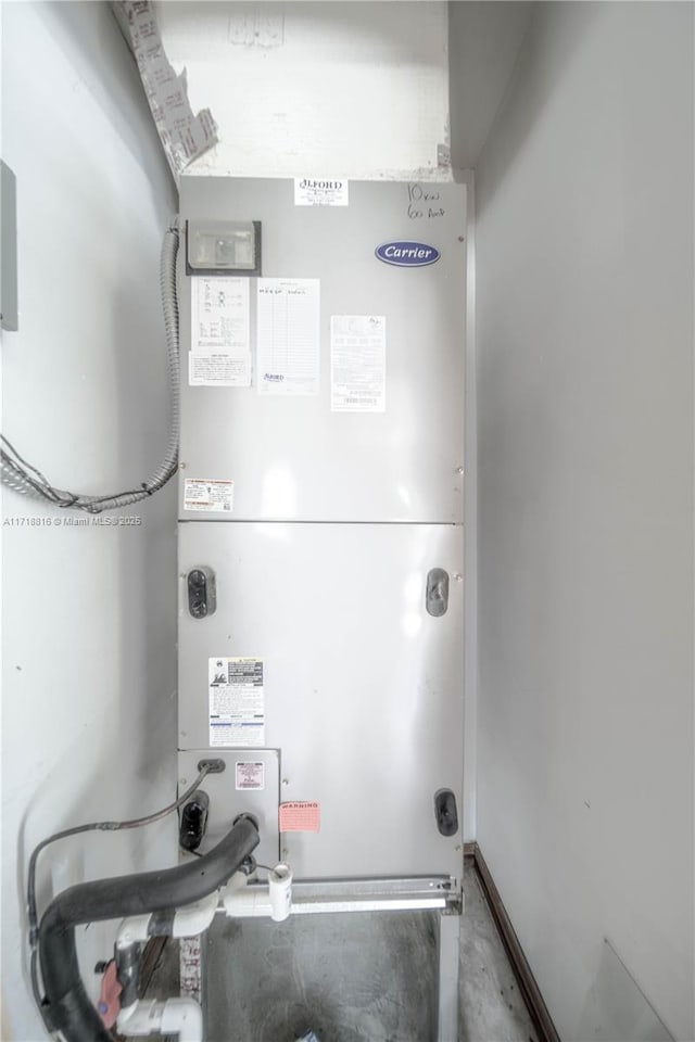 utility room with heating unit