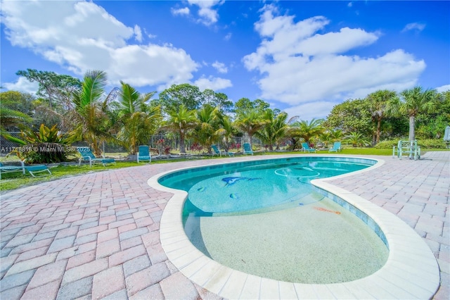 view of pool featuring a patio area