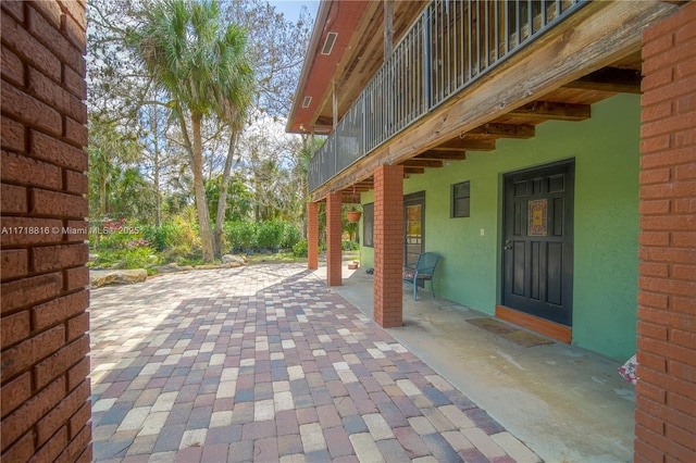 view of patio / terrace with a balcony