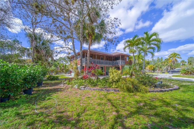 view of yard featuring a sunroom
