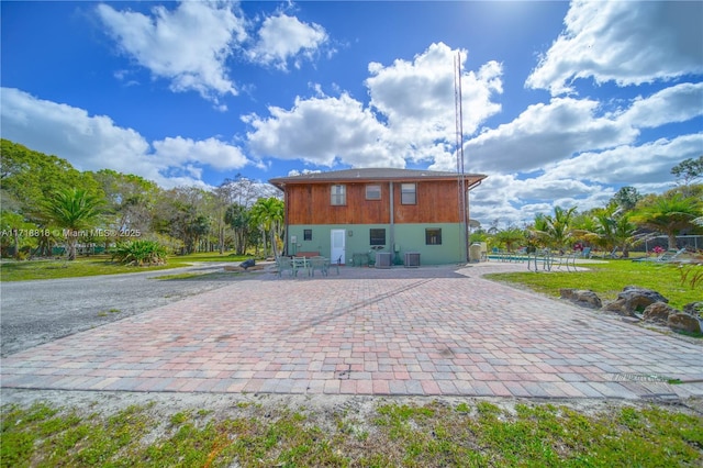back of house featuring central AC