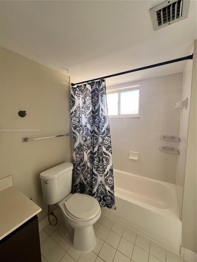 full bathroom with shower / bath combo, vanity, tile patterned floors, and toilet